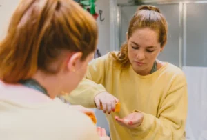 Young Adult Woman Taking Medicine